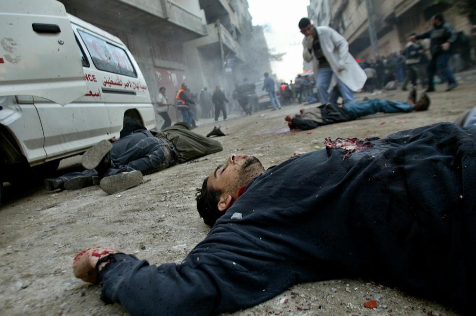 File photo of unidentified bodies lying on a street in the Jabalya refugee camp in northern Gaza Strip