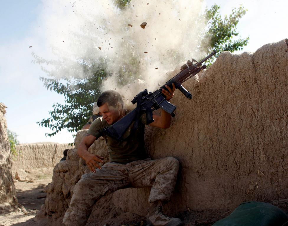 File photo of Sgt. William Olas Bee, a U.S. Marine coming under Taliban fire in Helmand