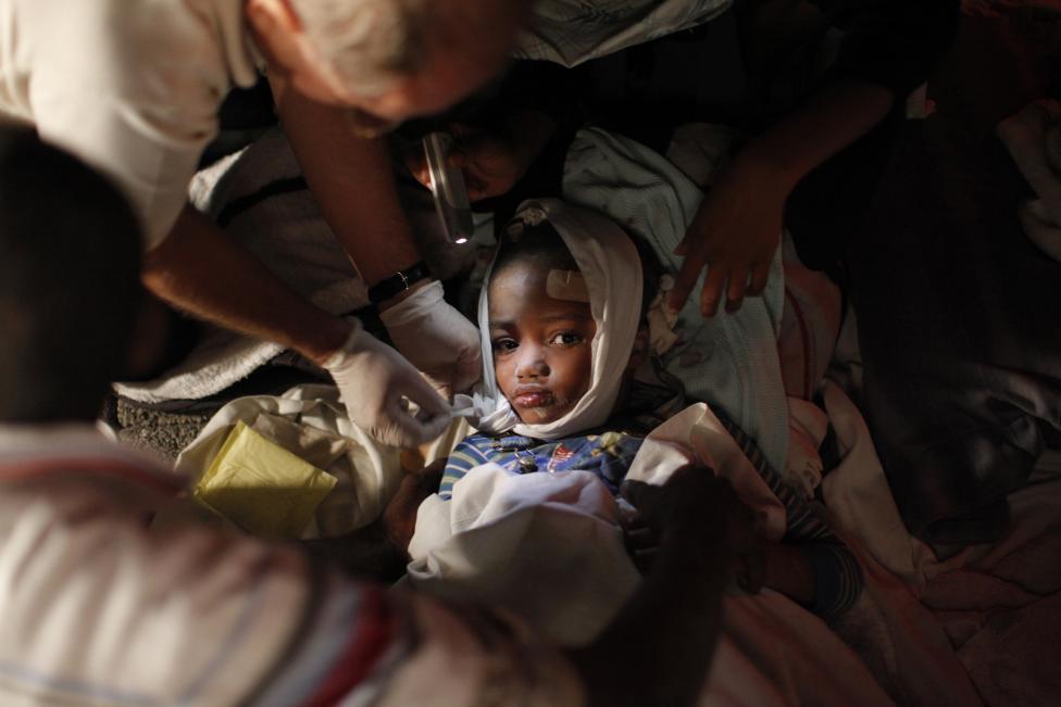 File photo of an injured child receiving medical treatment after an earthquake in Port-au-Prince