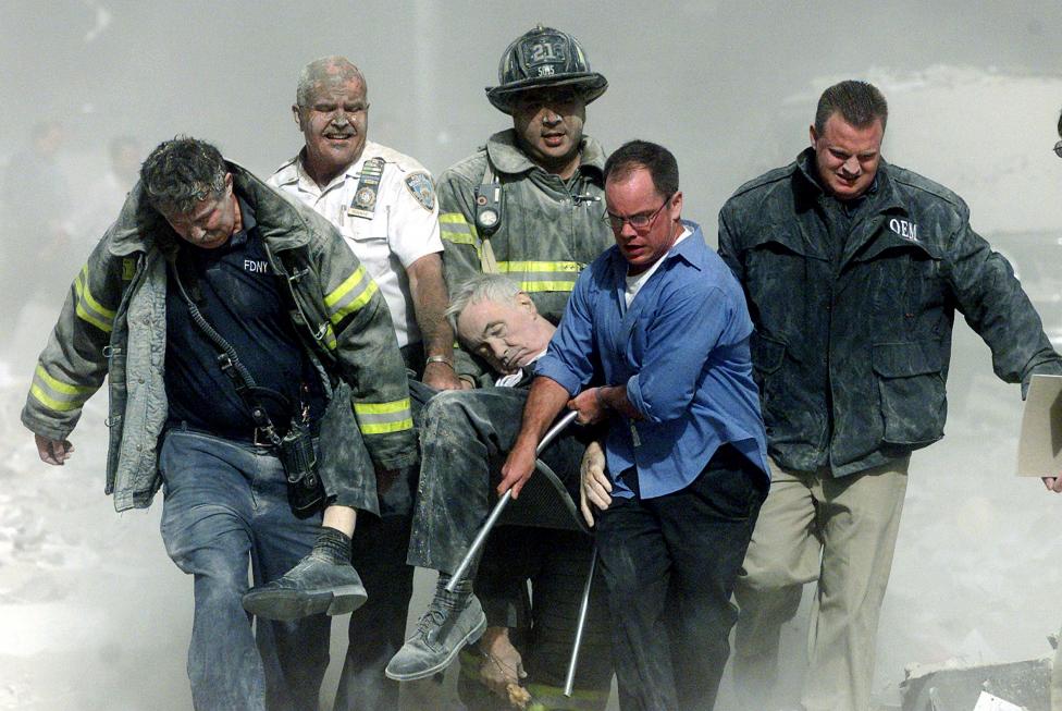 File photo of rescue workers carrying fatally injured New York City Fire Department Chaplain, Father Mychal Judge from the World Trade Centre