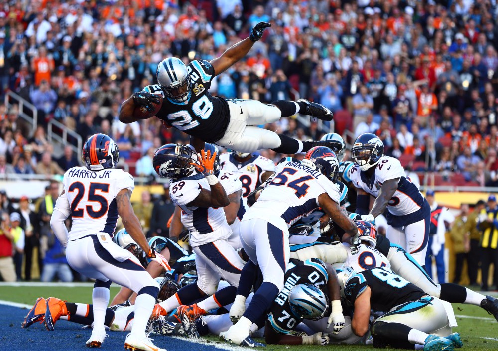 Feb 7, 2016; Santa Clara, CA, USA; Carolina Panthers running back Jonathan Stewart (28) dives over the pile of defenders for a touchdown against the Denver Broncos in the second quarter in Super Bowl 50 at Levi's Stadium. Mandatory Credit: Mark J. Rebilas-USA TODAY Sports ORG XMIT: USATSI-245820 ORIG FILE ID: 20160207_jla_su5_171.jpg