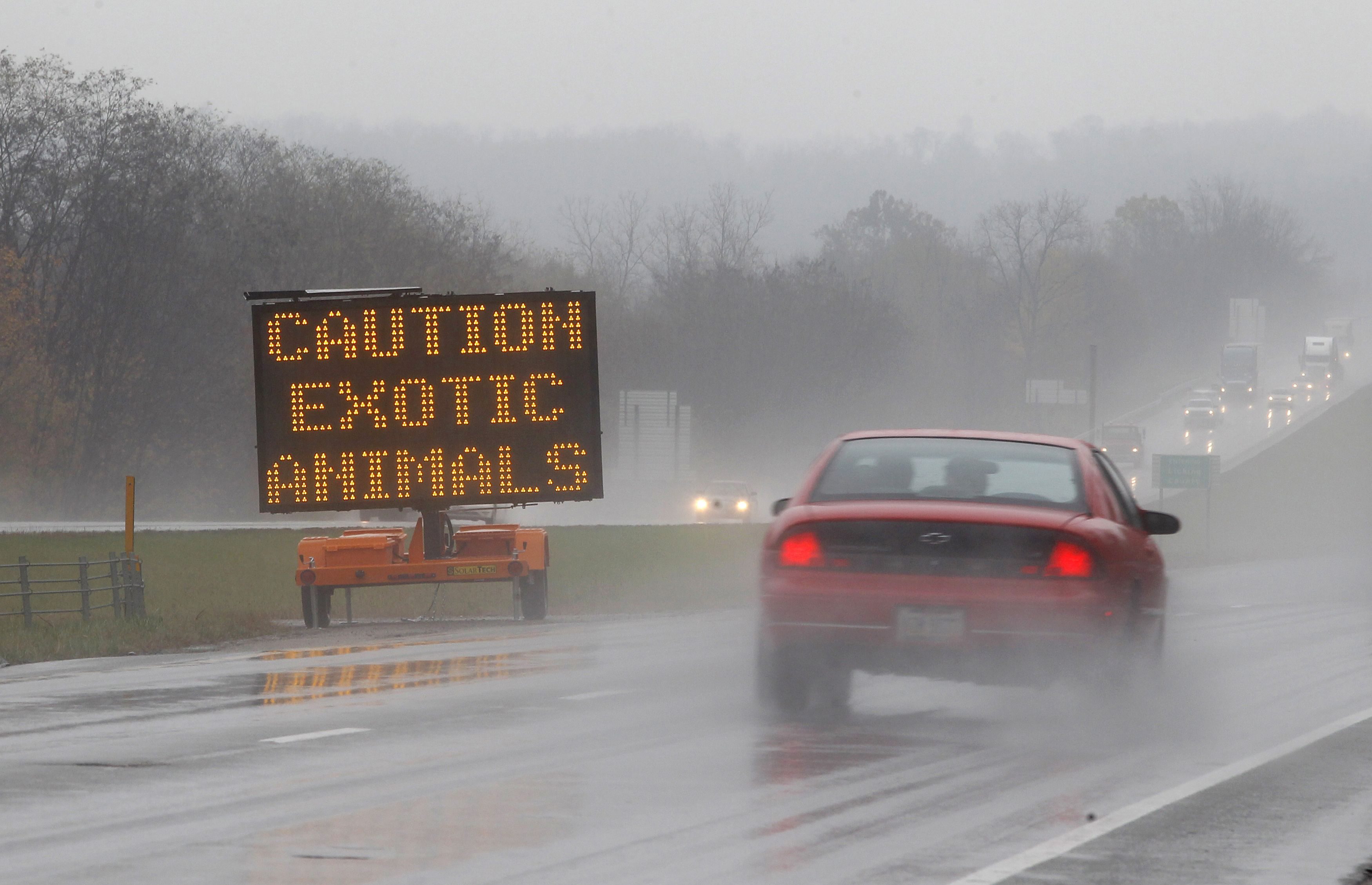 A sign posted on Interstate 70 warns drivers of animals loose in the area around Zanesville