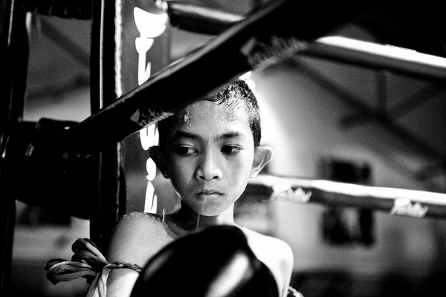 Boy in a boxing ring during the break.