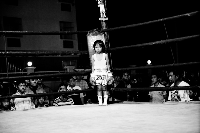 Girl, 6 years, in a boxing ring. Muay Thai (Thai Boxing) is one