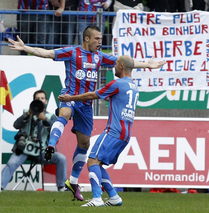 Caen's Mollo celebrates with teammate Nivet  after scoring against Olympique Marseille during their French Ligue 1 soccer match at the Michel D'Ornano's stadium in Caen