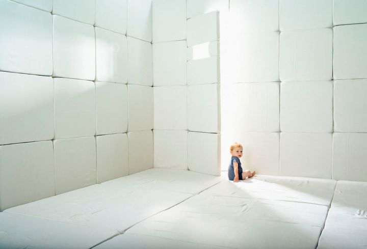 Baby in padded cell
