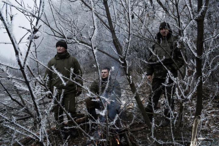 ARTEMIVSK, UKRAINE - FEBRUARY 15: Ukrainian soldiers conduct operations along the road leading to the embattled town of Debaltseve on February 15, 2015. A ceasefire began at midnight between Pro-Russian Separatists and the Ukrainian forces brokered by the EU, Russia and Ukraine. Debaltseve has become the focal point with reportedly 8000 Ukrainian forces trapped in a bottleneck inside the city.