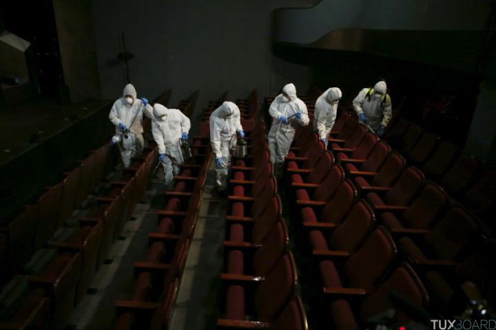 Employees from a disinfection service company sanitize the interior of a theater in Seoul, South Korea, June 18, 2015. An outbreak of Middle East Respiratory Syndrome (MERS) threatens to deal a blow to South Korea's economic recovery, Moody's Investors Service said on Thursday, as the Health Ministry reported three new cases, the lowest daily increase in 17 days. REUTERS/Kim Hong-Ji