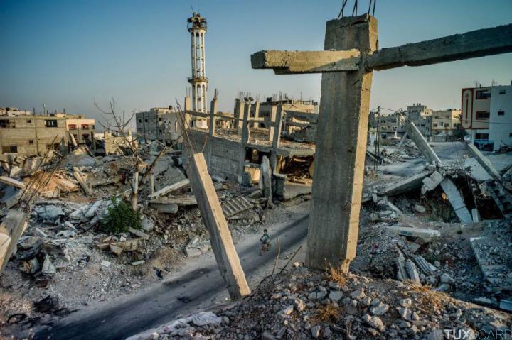 Shejaiya, the destroyed neighborhood abutting the border fence with Israel, in Gaza City, Gaza Strip, Aug. 1, 2015. A year after hostilities ended between Israel and Palestinian militants, not a single one of the nearly 18,000 homes destroyed or severely damaged in the fighting has been rebuilt, despite some $2.5 billion pledged for reconstruction. (Tomas Munita/The New York Times)