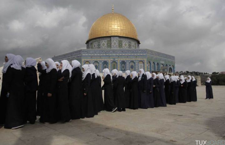 Palestinian school girls walk in line past the Dome of the Rock at the Al-Aqsa mosque compound in Jerusalem's Old City on October 27, 2015. Israeli Prime Minister Benjamin Netanyahu scrambled to contain inflammatory rhetoric from his government over the holy site, which is sacred to both Muslims and Jews, at the heart of a wave of deadly Palestinian unrest. AFP PHOTO/AHMAD GHARABLIAHMAD GHARABLI/AFP/Getty Images