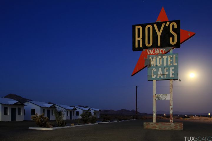 My first time shooting Roy's at night. A full moon makes for a great back drop of the world's famous Roy's sign. Roy's Motel and Cafe is a defunct motel, cafe, gas station, auto repair shop on the National Trails Highway of U.S. Route 66 in the Mojave Desert town of Amboy in San Bernardino County, California. The historic site is an example of roadside Mid-Century Modern Googie architecture.