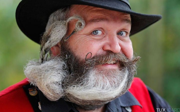 German hairdresser Weisser, poses with his beard, which is shaped as a stork, during the 2012 European Beard and Moustache Championships in Wittersdorf near Mulhouse...German hairdresser Elmar Weisser, 48, poses with his beard, which is shaped as a stork, during the 2012 European Beard and Moustache Championships in Wittersdorf near Mulhouse, Eastern France, September 22, 2012. Weisser, who won the World Beard and Moustache Championship in 2011, ranked second in the freestyle category of the European championships on Saturday. Picture taken September 22, 2012. REUTERS/Vincent Kessler (FRANCE - Tags: SOCIETY TPX IMAGES OF THE DAY)