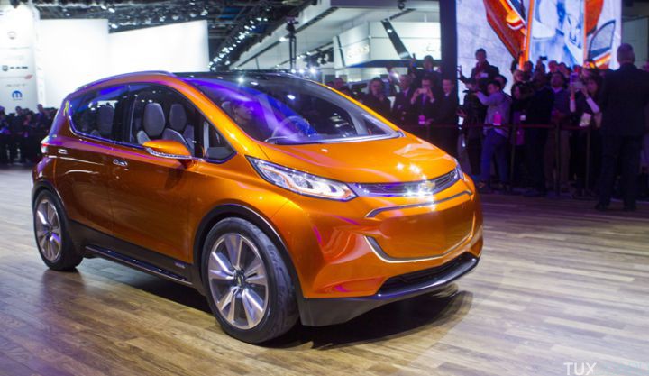 The Chevrolet Bolt EV electric concept vehicle is driven onto the stage at a presentation during the North American International Auto Show, Monday, Jan. 12, 2015, in Detroit. (AP Photo/Tony Ding)