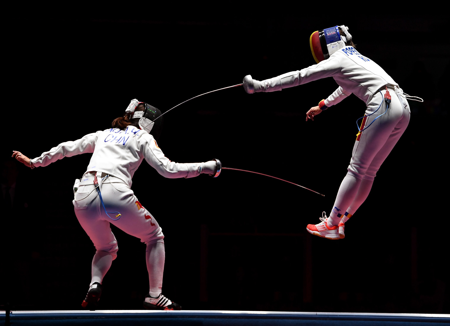 RIO DE JANEIRO, BRAZIL - AUGUST 11: Ana Maria Popescu of Romania competes against Anqi Xu of China during the Women's Epee Team Gold Medal Match bout on Day 6 of the 2016 Rio Olympics at Carioca Arena 3 on August 11, 2016 in Rio de Janeiro, Brazil. (Photo by Laurence Griffiths/Getty Images)