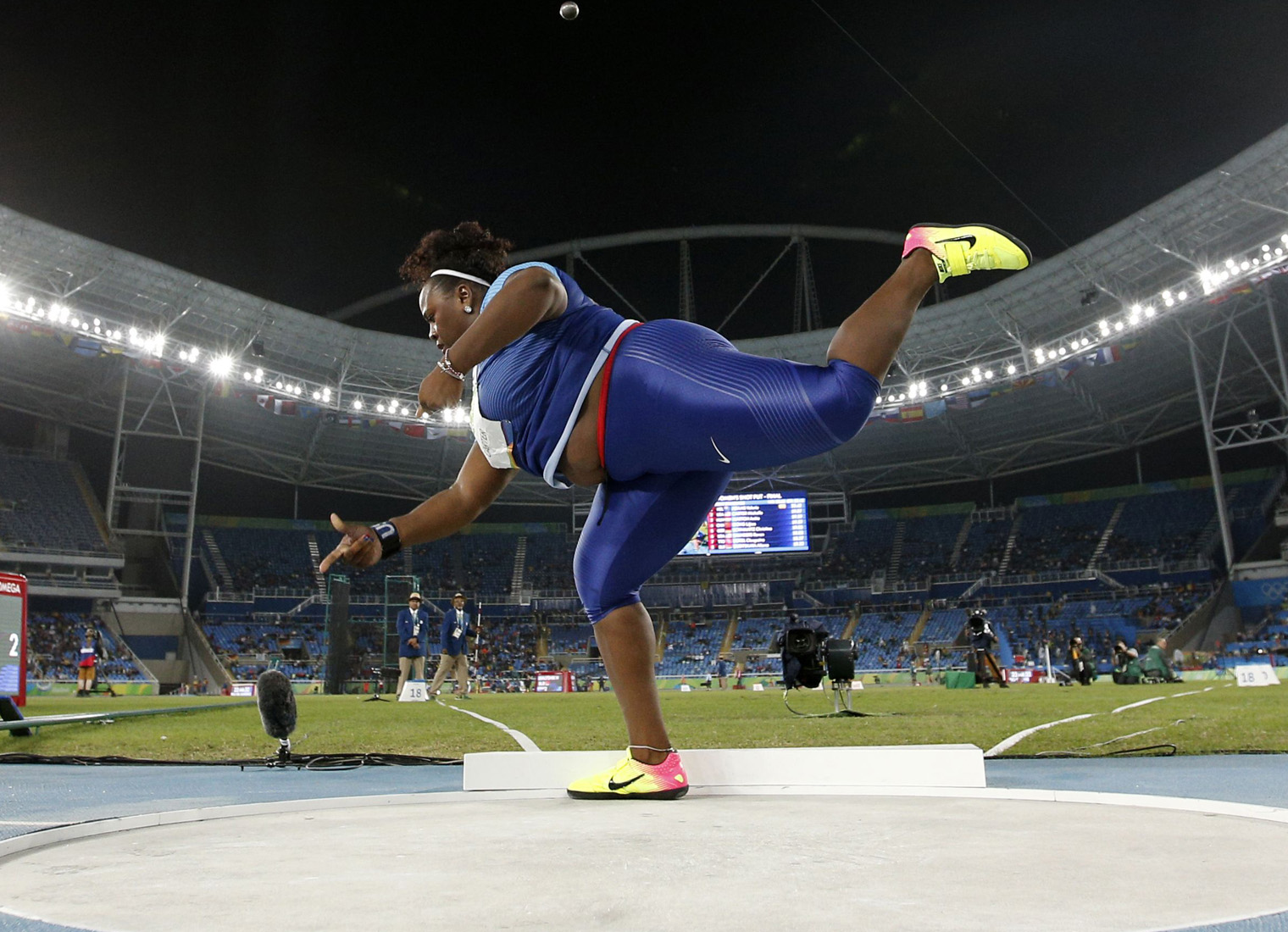 TOPSHOT - USA's Michelle Carter competes in the Women's Shot Put Final during the athletics event at the Rio 2016 Olympic Games at the Olympic Stadium in Rio de Janeiro on August 12, 2016. / AFP / Adrian DENNIS (Photo credit should read ADRIAN DENNIS/AFP/Getty Images)