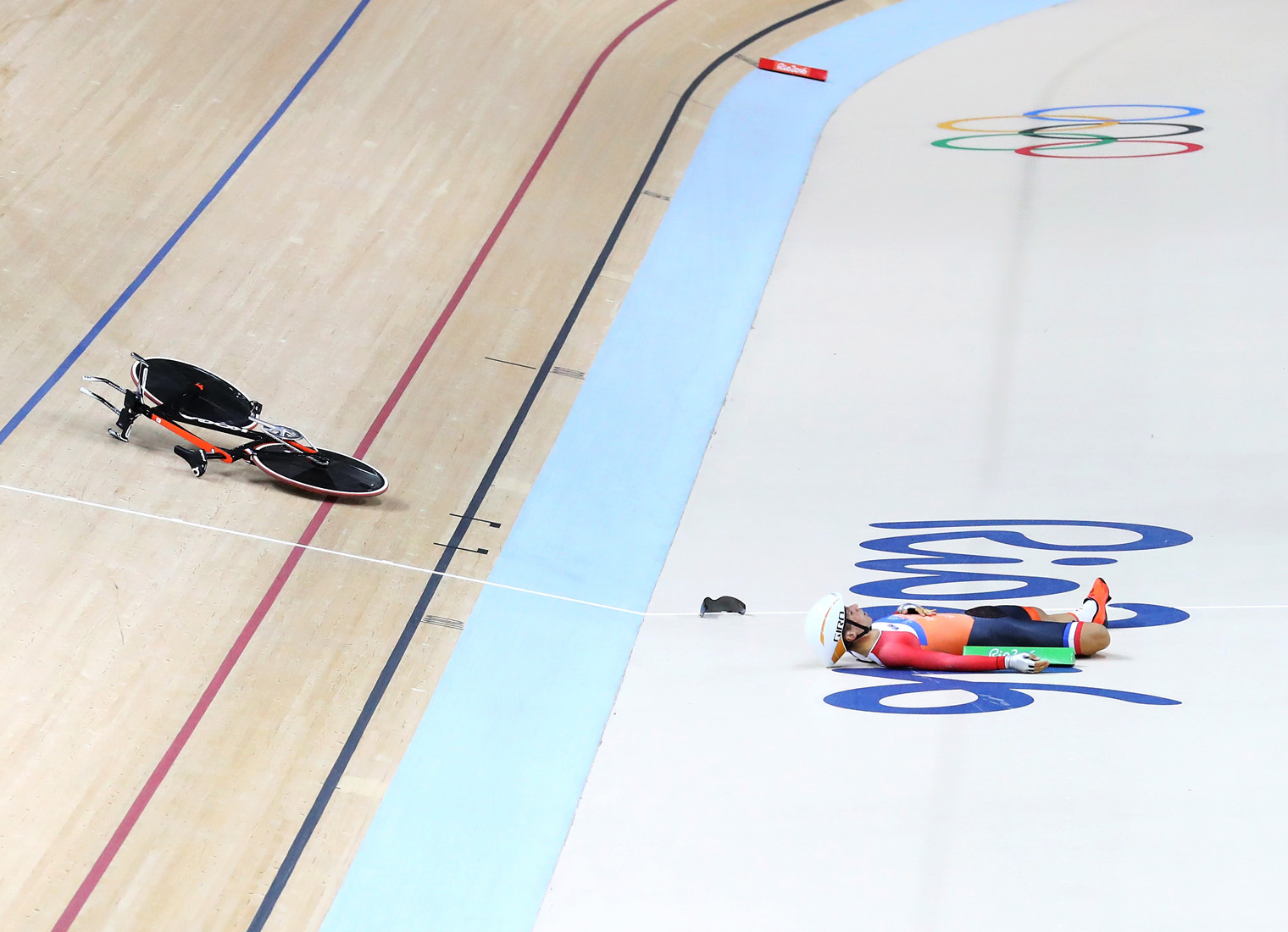 RIO DE JANEIRO, BRAZIL - AUGUST 11: Joost van der Burg of Netherlands crashes in the Men's Team Pursuit Track Cycling Qualifying on Day 6 of the 2016 Rio Olympics at Rio Olympic Velodrome on August 11, 2016 in Rio de Janeiro, Brazil. (Photo by Ryan Pierse/Getty Images)