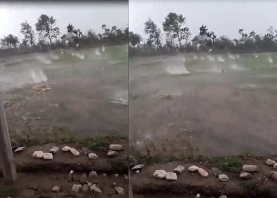 Une violente tempête de grêle détruit une rizière, on croirait voir une attaque armée avec des projectiles