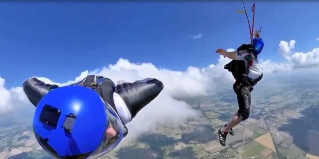 Un homme et une femme enceinte effectuent un incroyable saut dans le vide avec un parachute et un Wing suit
